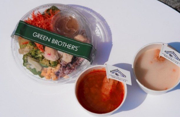 A green brothers salad and soup combo. 